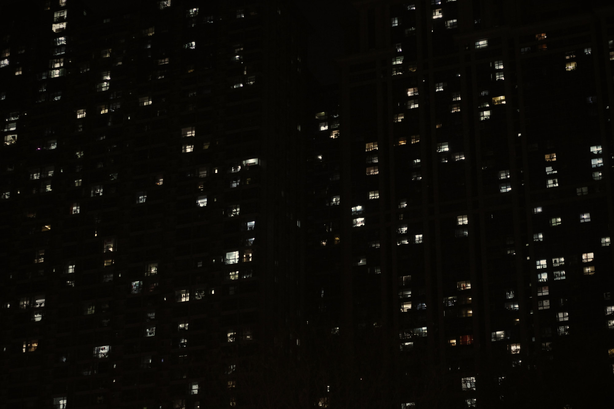 Lit windows of an office tower at night